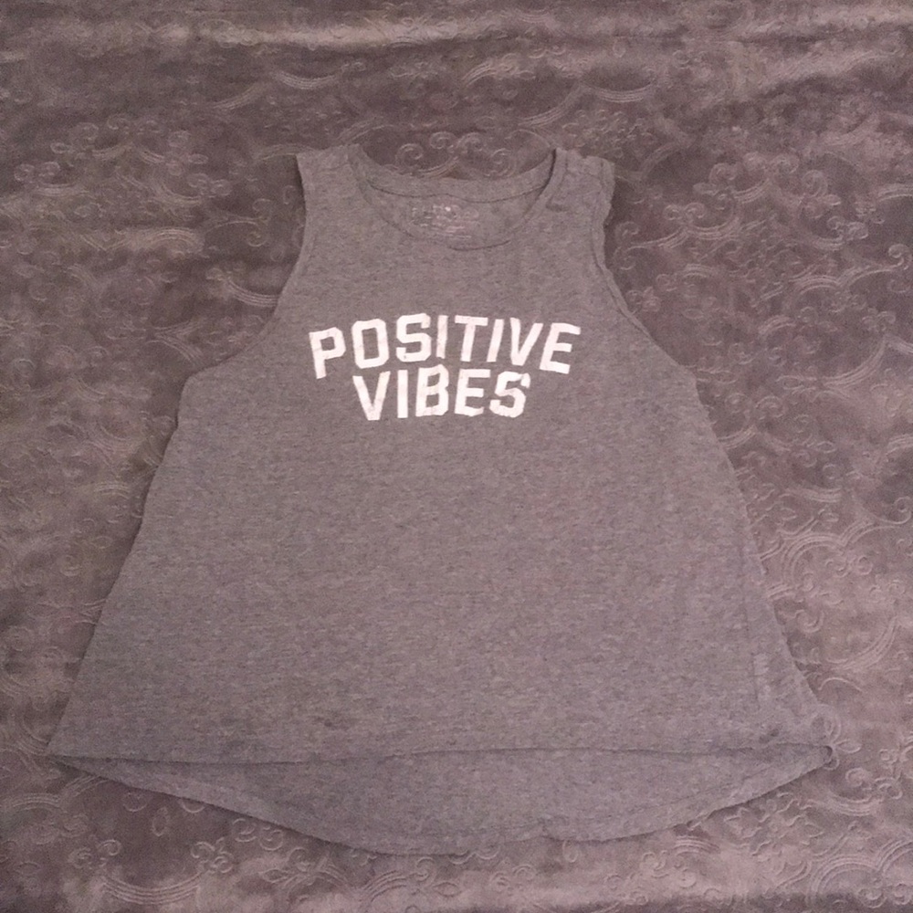 Tank top. “Positive vibes”